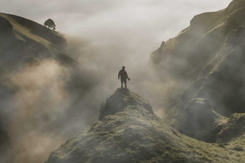 man-standing-cliff-with-fog-overlay-texture_optimized