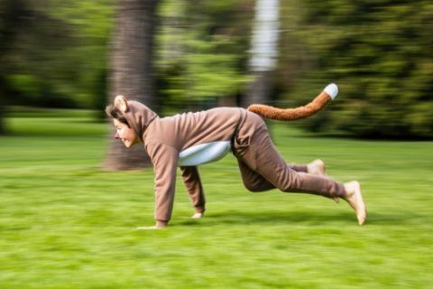 playful-person-animal-costume-running-park_optimized