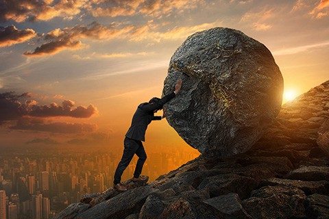Business man pushing large stone up to hill , Business heavy tasks and problems concept.